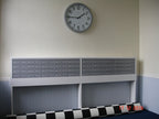 Wall mounted E1 commercial post boxes mounted on the stand