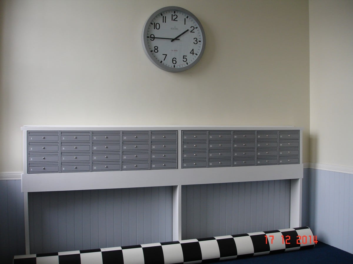Wall mounted E1 commercial post boxes mounted on the stand